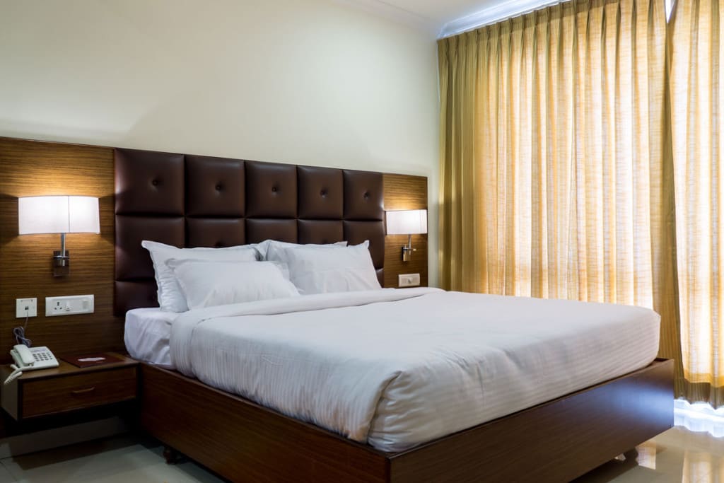 Suite bedroom at Hotel Saptagiri